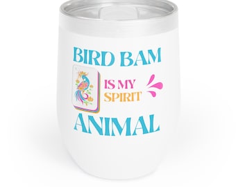 May include: White insulated tumbler with a silver rim and lid. The tumbler features the text "BIRD BAM IS MY SPIRIT ANIMAL" in blue, orange, and pink. A colourful illustration of a bird is also on the tumbler.
