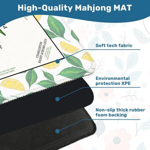 May include: A high-quality Mahjong mat with a lemon and leaf pattern. The mat features a soft tech fabric, environmental protection XPE, and a non-slip thick rubber foam backing. The text "High-Quality Mahjong MAT" is at the top.