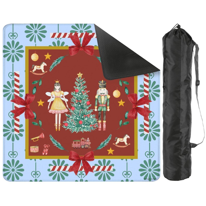 May include: A Christmas-themed mat with a red center featuring a Christmas tree, a fairy, and a nutcracker. The mat has a blue border with floral and candy cane designs, and red bows. A black carrying bag is included.