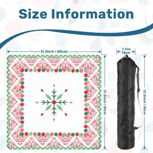 May include: A white square tablecloth with a red and green damask pattern and a snowflake design. The tablecloth measures 31.5 inches (80cm) square. A black carrying bag is also shown, measuring 33.5 inches (85cm) long. The text "Size Information" is at the top.