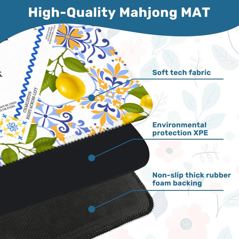 May include: A high-quality Mahjong mat with a lemon and floral design. The mat features a soft tech fabric, environmental protection XPE, and a non-slip thick rubber foam backing. The top layer has a white background with yellow lemons and blue and yellow floral patterns.