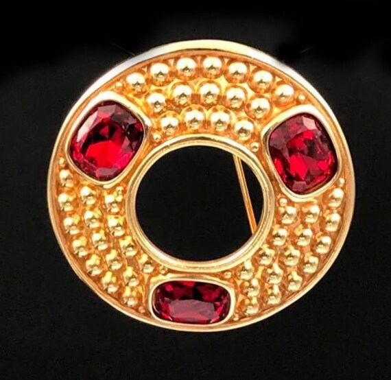 Vintage Swarovski gold fiinish circle Statement brooch. Bezel set red crystal stones . With SAL trademark .  From  the 1980's