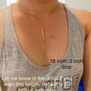 May include: A gold chain necklace with small clear stones. The necklace is 18 inches long with a 3 inch drop. The text "Let me know in the order if you want this length, default is 20 inch - 4 inch drop" is visible in the image.