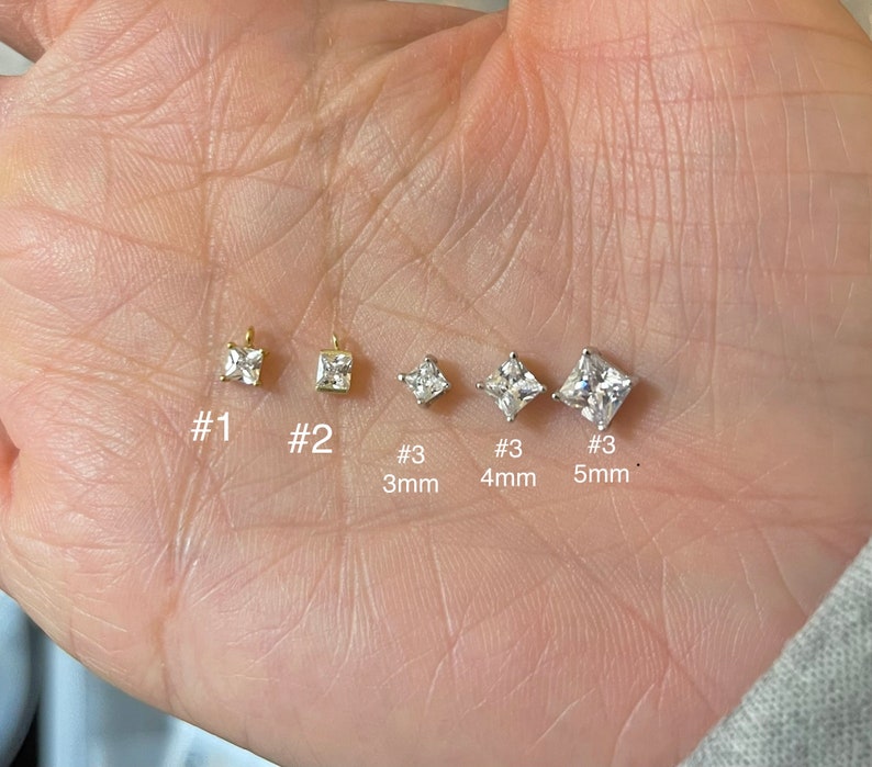 May include: A collection of square-cut, clear gemstone earrings in various sizes. The earrings are set in gold and silver tones, with sizes ranging from 3mm to 5mm. The image includes labels #1, #2, and #3 to indicate different styles.