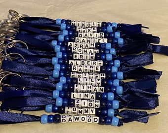 Personalised beaded bag tag or keychain for school bags, PE bags or handbag. Student and teacher present.