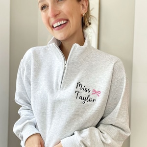 Personalized Teacher Mini Bow Quarter Zip Sweatshirt | Coquette Teacher Top | Gift for a New Teacher | Cute Teacher Gift | 995ETB1