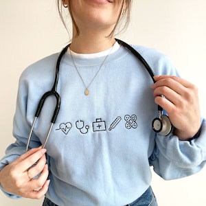 Nurse Cute Icon Gemma Crewneck Sweatshirt | Personalized Gift For Nurse Student | Crewneck Fleece Sweatshirt | Nurse Week Gift | RN Top