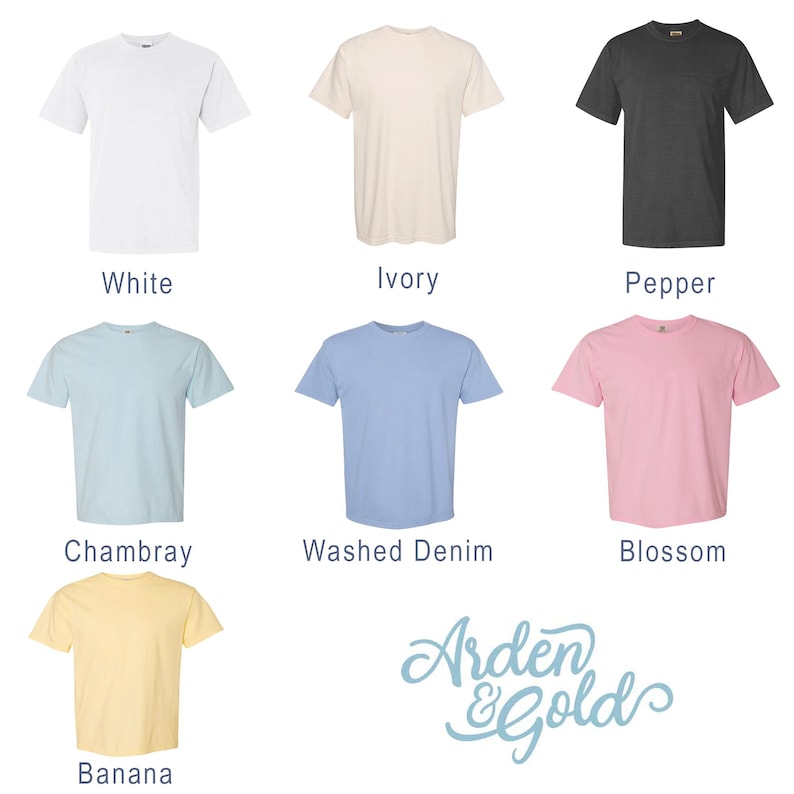 May include: A collection of short-sleeved t-shirts in various colors, including white, ivory, pepper, chambray, washed denim, blossom, and banana. The shirts are displayed with their respective color names below each garment. The Arden & Gold logo is also visible.