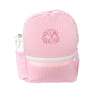 May include: Pink gingham backpack with a white zipper and a pink monogrammed "E.S.S." on the front. The backpack has a side pocket for a water bottle.