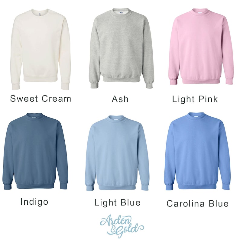 May include: Six crewneck sweatshirts in various colors: Sweet Cream, Ash, Light Pink, Indigo, Light Blue, and Carolina Blue. The sweatshirts are displayed on a white background. The brand name "Arden & Gold" is at the bottom.