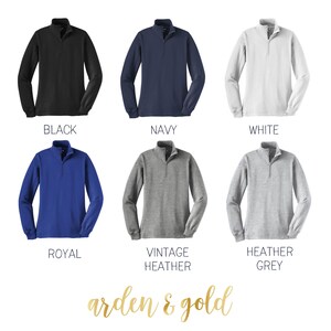 May include: Six different color options for a long-sleeved, mock neck, zippered pullover shirt. The colors are black, navy, white, royal blue, vintage heather grey, and heather grey.