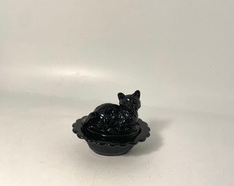 Cat on a basket by Mosser Glass