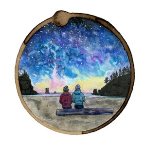 May include: A watercolor painting of two people sitting on a log, looking out at a starry night sky over a beach. The sky is a vibrant blue with purple and pink clouds, and the beach is a sandy brown.