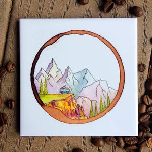 May include: A watercolor painting of a mountain landscape with a blue van driving along a cliff. The painting is framed by a brown coffee ring.