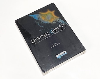 May include: A black DVD box with a blue and yellow image of Earth and the text "planet earth prepare to see it as never before 5 DVD COLLECTORS EDITION Discovery Channel".