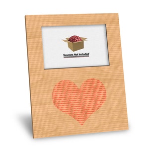May include: A brown picture frame with a white mat and a red brain inside a cardboard box. The text "Neurons Not Included" is printed below the box. The frame is decorated with a heart shape made of red binary code.
