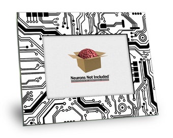 May include: A black and white picture frame with a circuit board design. The frame has a cutout for a photo and the text "Neurons Not Included" is printed on the bottom.