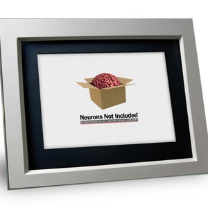 May include: A silver picture frame with a black mat and a white background. The image shows a brain inside a cardboard box with the text "Neurons Not Included" and "Accoutrements of Exceptional Greenery".