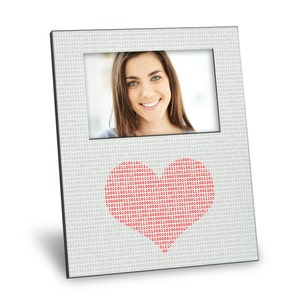 May include: A gray picture frame with a black border and a heart-shaped design made of red binary code. The frame has a photo of a woman smiling.