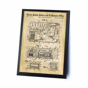 May include: A black and white vintage patent drawing for a compact magnetic disk storage system. The drawing shows a detailed diagram of the system's components, including a disk drive, a read/write head, and a control unit. The patent number is 4,217,446 and the date is February 21, 1882.