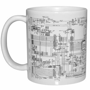 May include: White ceramic mug with a black and white circuit board design printed on the front. The design is a detailed schematic of a circuit board with various components and connections.