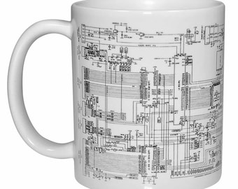 May include: White ceramic mug with a black and white circuit board design printed on the front. The design is a detailed schematic of a circuit board with various components and connections.