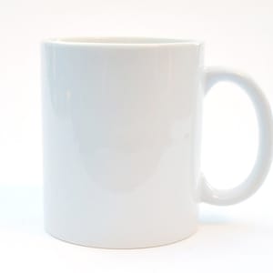 May include: A plain white ceramic mug with a handle.