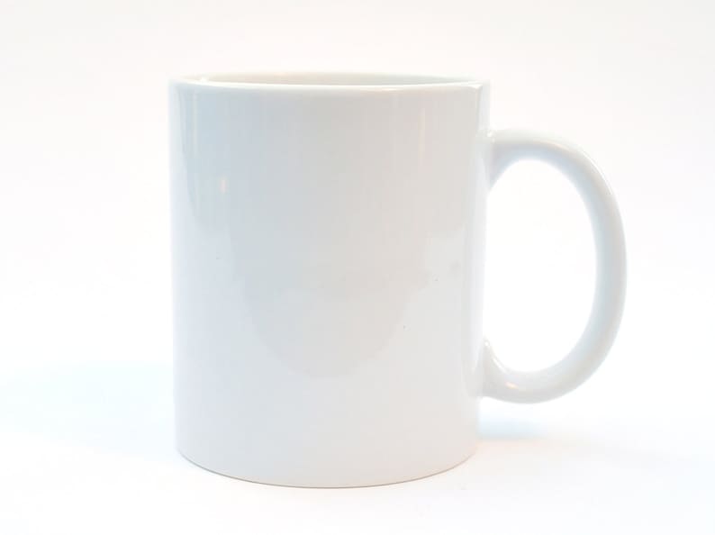 May include: A plain white ceramic mug with a handle.
