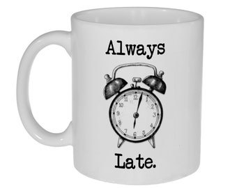 May include: White ceramic mug with a black and white illustration of an alarm clock and the text "Always Late."