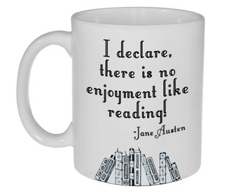 May include: White ceramic coffee mug with a black quote that reads "I declare, there is no enjoyment like reading! -Jane Austen". The quote is surrounded by a black and white illustration of a stack of books.