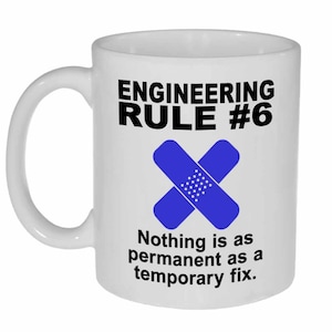 May include: White ceramic mug with the text "ENGINEERING RULE #6" in black, featuring a blue bandage graphic. Below the graphic, the text reads "Nothing is as permanent as a temporary fix."