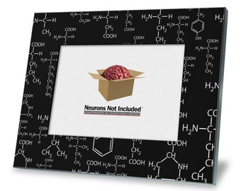 May include: A black picture frame with a white chemical formula pattern. The frame has a cardboard box with a red brain inside. The text "Neurons Not Included" is printed on the box.