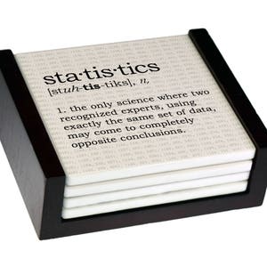 May include: A set of four white coasters with a black border and a humorous definition of "statistics" printed on the top coaster. The coasters are in a black wooden holder.