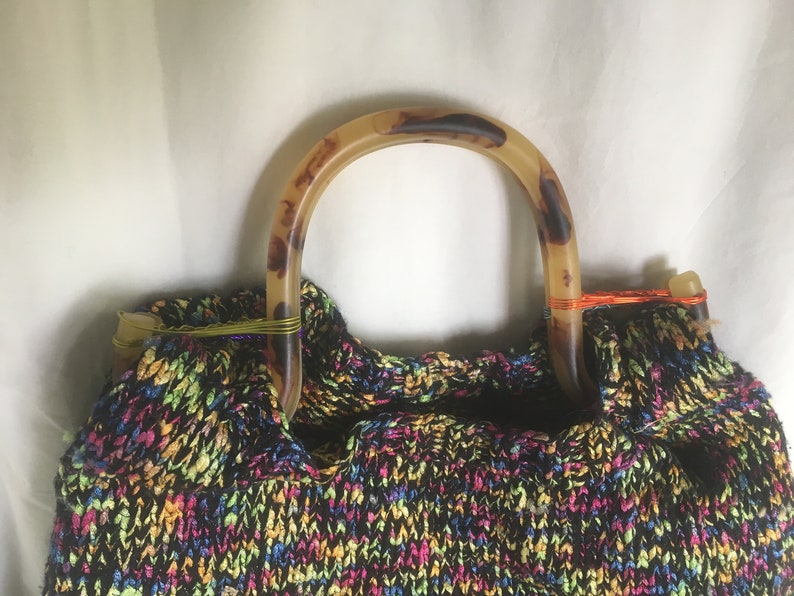 Triangle multi bag with tortoise-colored shell handles