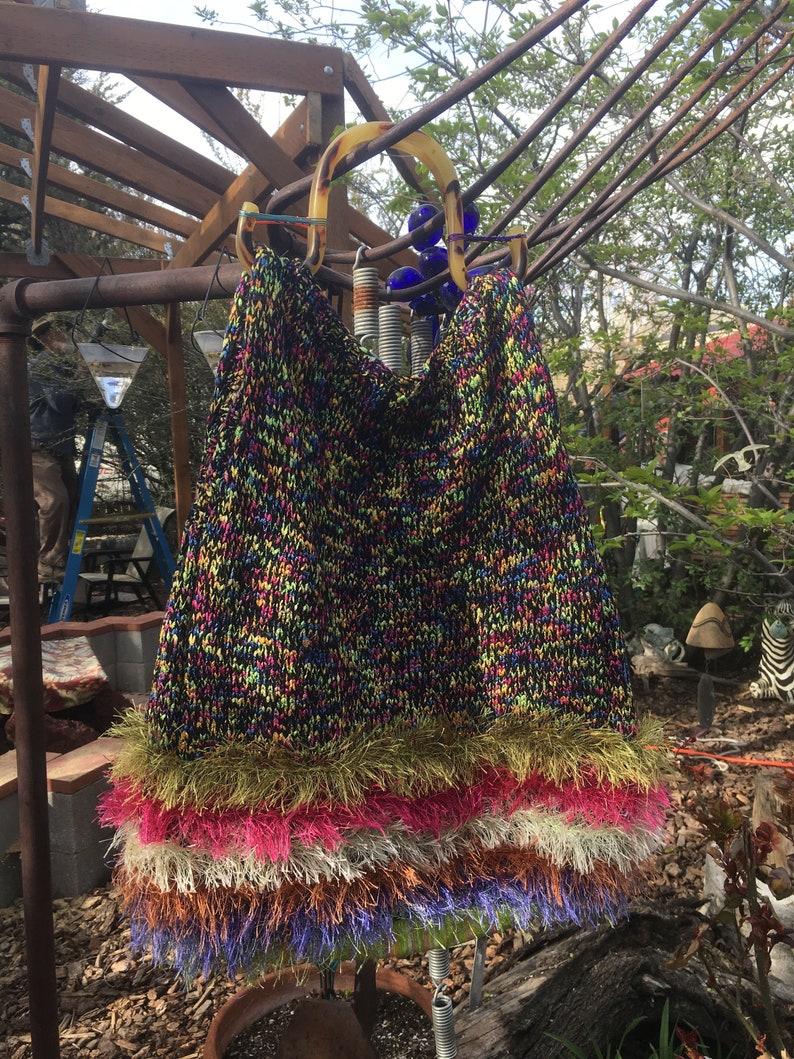 Triangle multi bag with tortoise-colored shell handles
