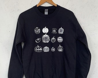 Moletom com estampa de abóbora desenhada à mão e gola redonda de Halloween