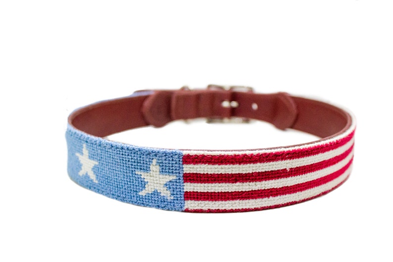 Hand stitched needlepoint stars and stripes dog collar by Asher Riley. Monogramming available. Leather and brass hardware.