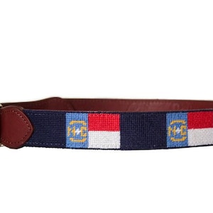 Hand stitched needlepoint North Carolina Flag dog collar by Asher Riley. Monogramming available. Leather and brass hardware.