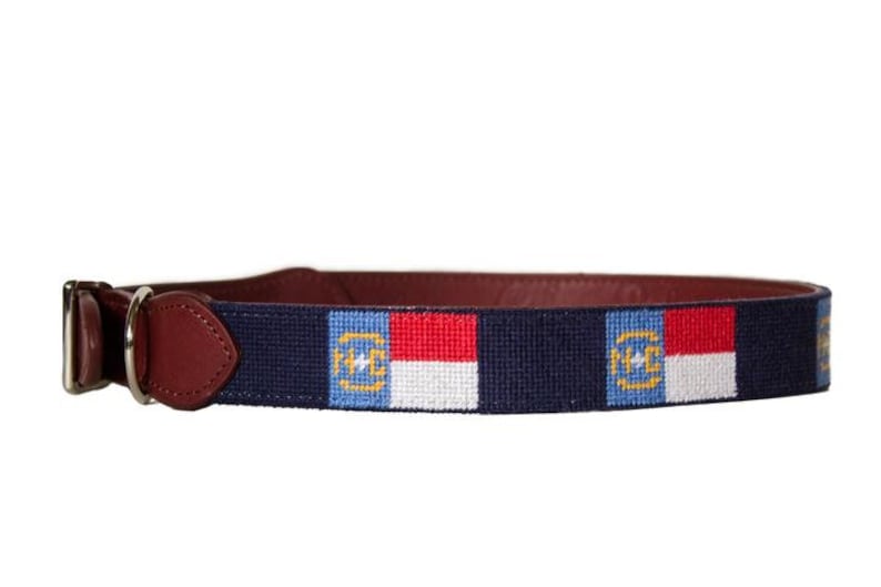 Hand stitched needlepoint North Carolina Flag dog collar by Asher Riley. Monogramming available. Leather and brass hardware.