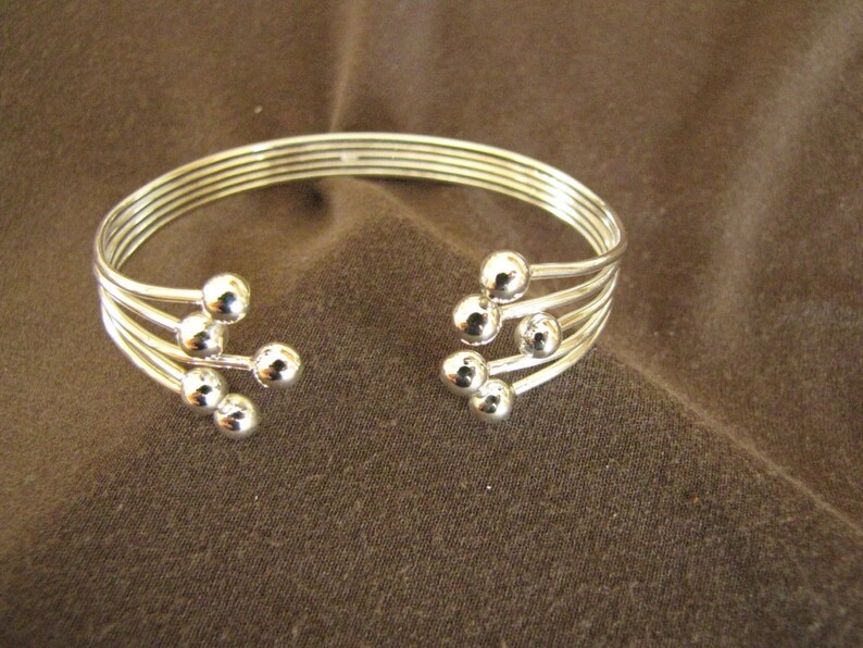 Sterlling Silver Open Front Balls Bangle