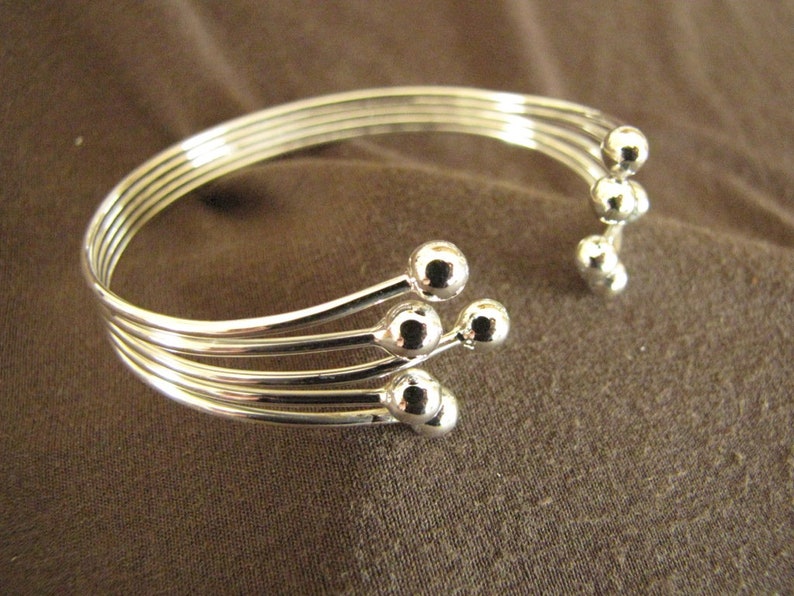 Sterlling Silver Open Front Balls Bangle