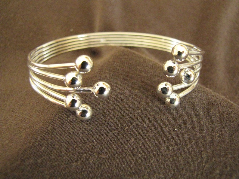 Sterlling Silver Open Front Balls Bangle