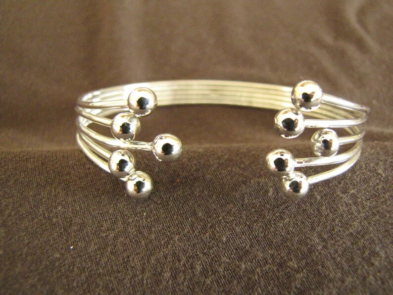 Sterlling Silver Open Front Balls Bangle