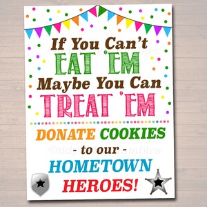 May include: A colorful printable sign with the text "If You Can't Eat 'Em Maybe You Can Treat 'Em Donate Cookies to our Hometown Heroes!" The sign features a festive design with colorful flags and confetti.