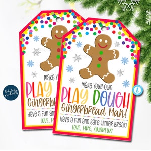 May include: Two gift tags with a gingerbread man design. The tags have a red border and colourful confetti at the top. Text on the tags reads "Make Your Own Play Dough Gingerbread Man!" and "Have a Fun and Safe Winter Break!"