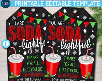 May include: Two printable Christmas gift tags with a chalkboard background. The tags feature a red and green soda cup with a straw, snowflakes, and the text "You are soda-lightful. Thanks for all that you do! Happy Holidays! Love, The Pinewood PTO".