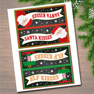 May include: Four printable Christmas gift tags with a chalkboard background. The tags feature Santa and an elf with the text "Santa Kisses" and "Elf Kisses".