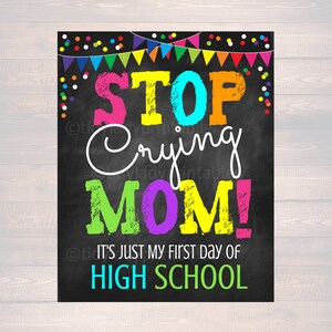 May include: A colorful chalkboard sign with the text "STOP Crying MOM! It's just my first day of HIGH SCHOOL". The sign is decorated with colorful confetti and bunting.