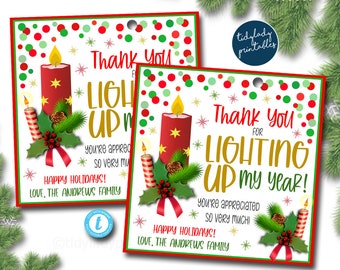 May include: Two red and green Christmas gift tags with a candle illustration and the text "Thank you for lighting up my year! You're appreciated so very much! Happy Holidays! Love, The Andrews Family."