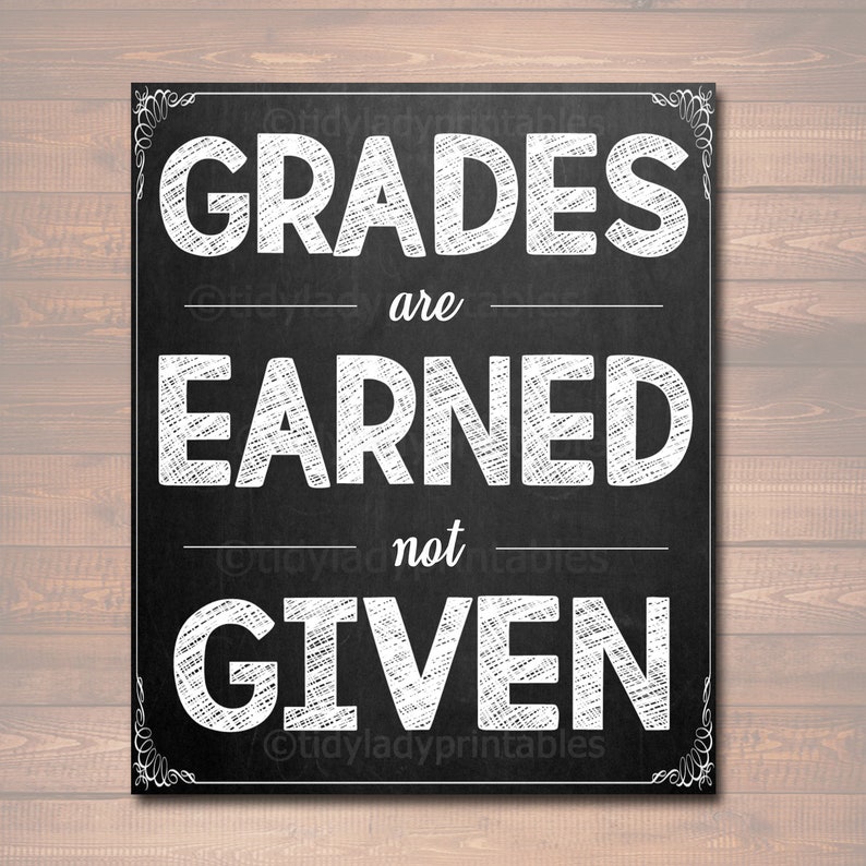 May include: Black and white chalkboard sign with the text "GRADES are EARNED not GIVEN".